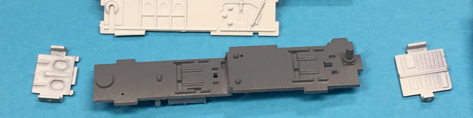 Cockpit tub parts, showing pre-cementing well painting