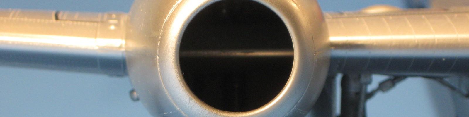The prominent leading-edge wing spar is visible crossing the intake. 