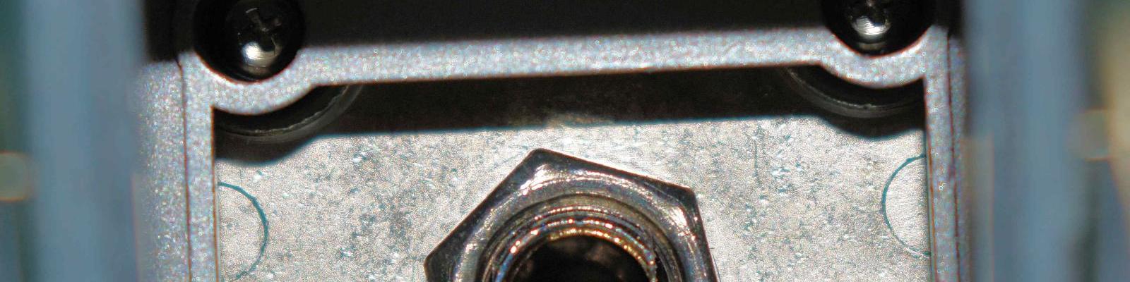 Bolt attachment holding plate in place