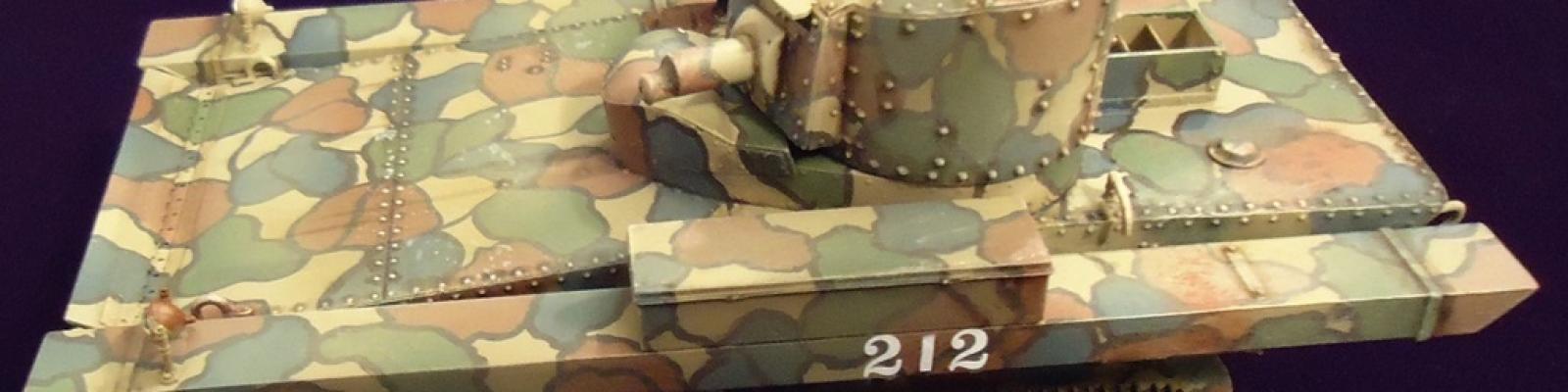 Complete tank with elaborate camouflage paint scheme.