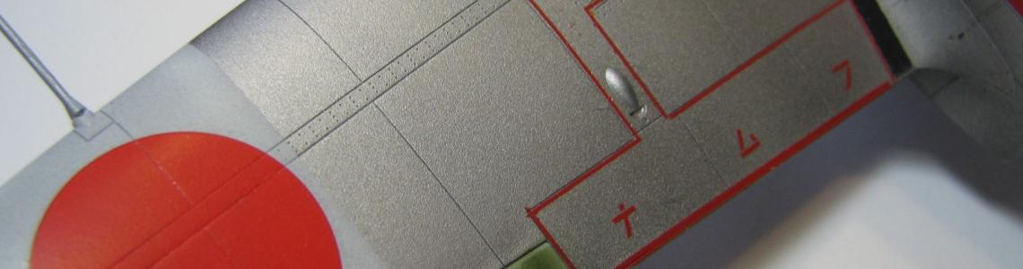 Upper wings surface with Hinomaru and wing walk detail.