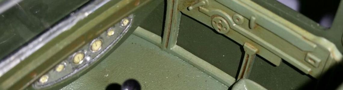 View in through top, showing interior including steering wheel and dash