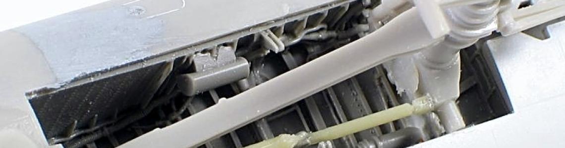 Installed nose gear well with oleo and strut structures