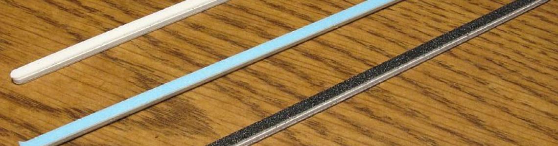 Included flat sanding sticks
