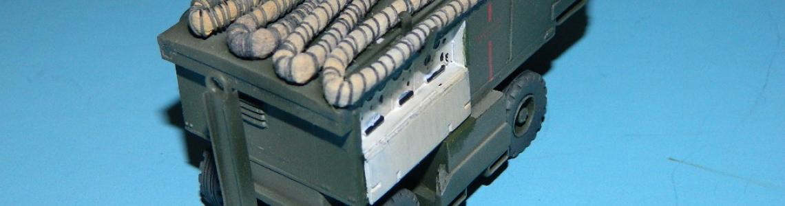 Generator with hose on top, and operator control panel (white) in foreground