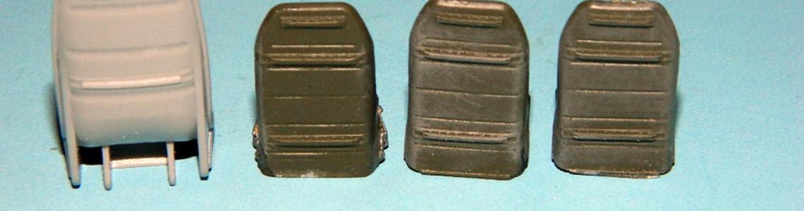 Rear of kit seat (gray, left) versus Resin2 Detail seats.