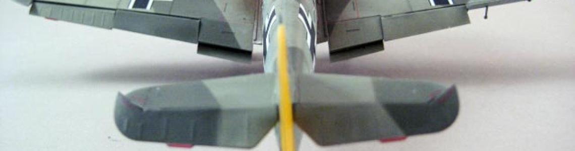 Aft view of aircraft, flaps on both sides clearly visible