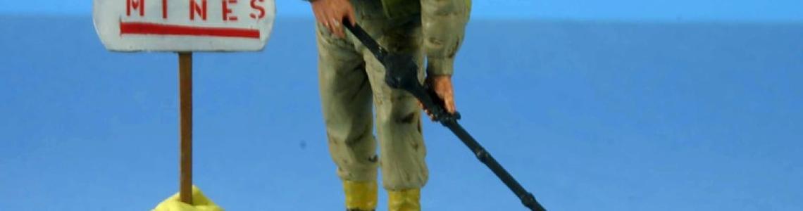 Soldier with mine detector