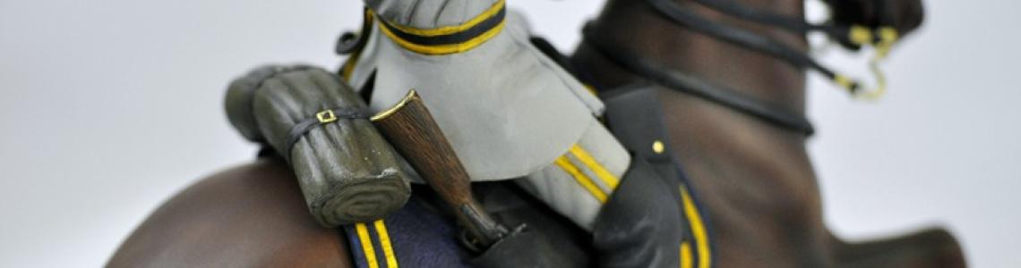 Figure from right showing riding gear