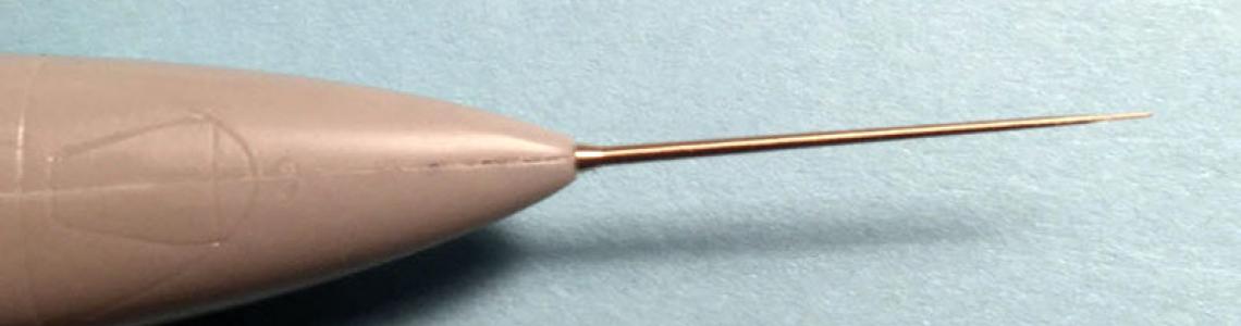 Installed part, after bent tip was corrected by described use of tweezers.