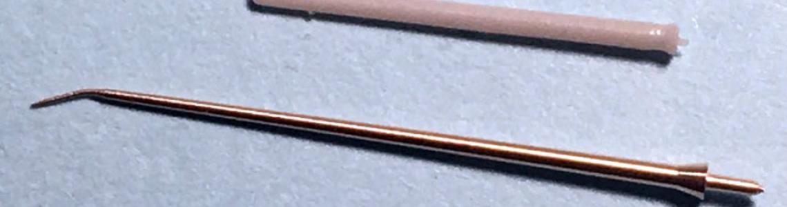Product, as delivered with bent tip, as compared to kit part.