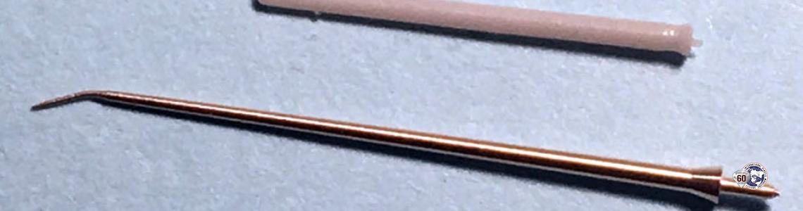 Product, as delivered with bent tip, as compared to kit part.