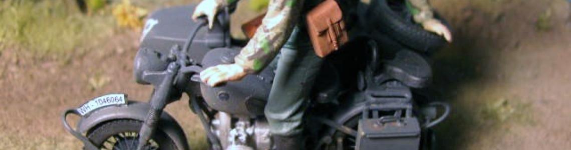 Completed motorcycle with figures in diorama