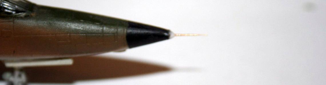 The Master Model part in place, with white glue applied to make the nose cone match up with the new  pitot tube