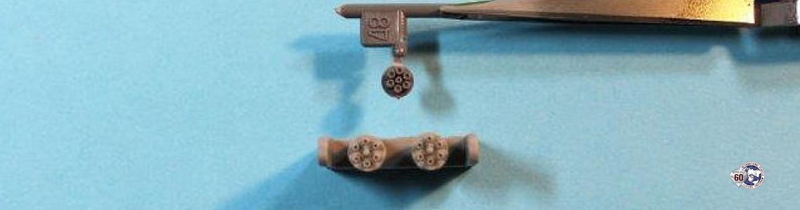 Comparison with kit part (in tweezers)