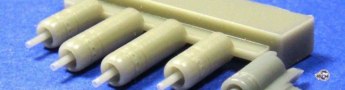 Kit-supplied barrel (right) versus aftermarket resin parts