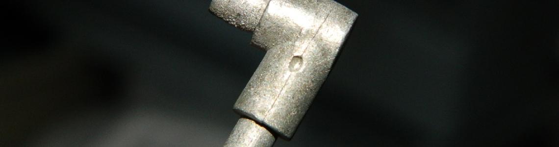 Scissor link hole before drilling