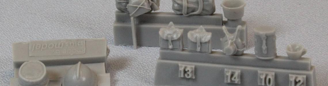 Helmets, rucksacks, canteens, cups, binocular case.