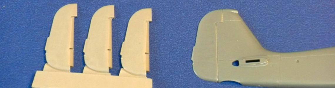 Quickboost.net parts on pour block compared to rudder on Tamiya kit