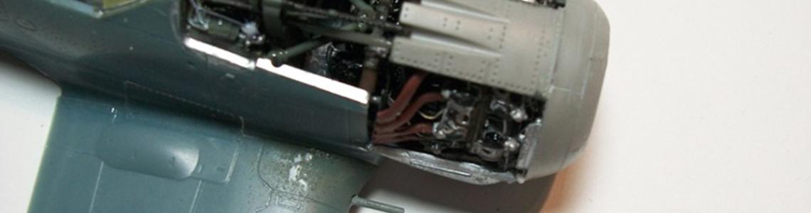 Engine cowling added, with guns through ports.