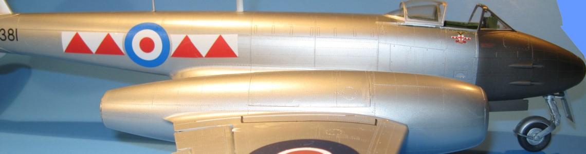 Starboard side view straight across the wing showing the prominent engines, the nose gear, and the distinctive RAF markings