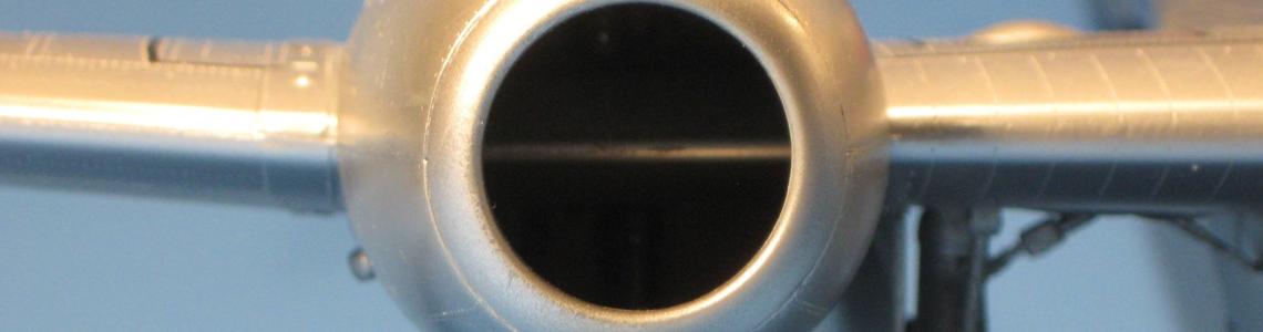 The prominent leading-edge wing spar is visible crossing the intake. 