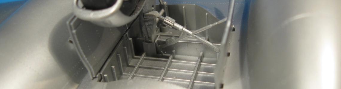 The main gear and well with associated hydraulics, struts and gear compartment covers are shown.