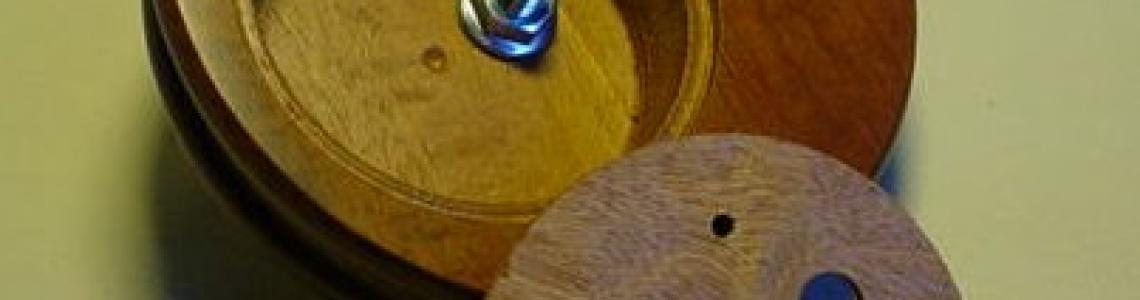 Attaching the resin figure base to the wooden base