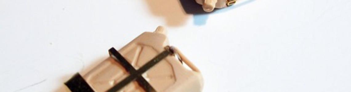 Gas container tie downs