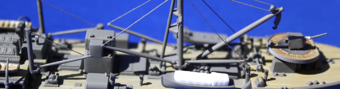 Close-up of aft cargo deck showing cables for spars from thin brass rod