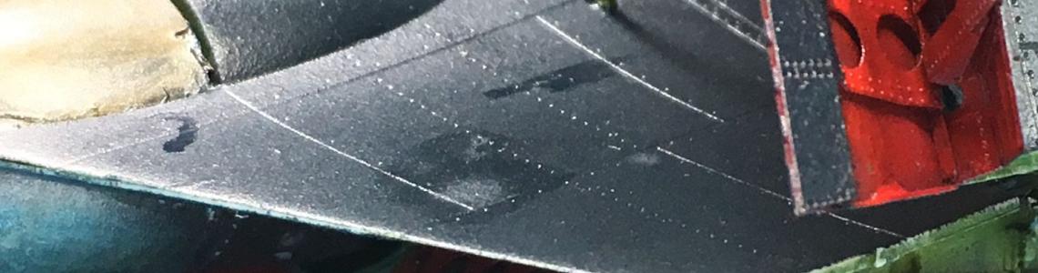 Installed flaps, before paint touch-up and position adjusting, some masking residue evident.