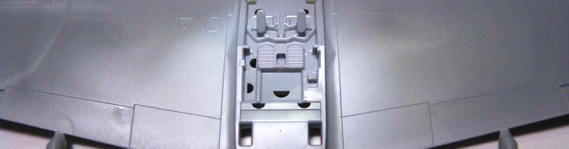 Cockpit floor integral with wings