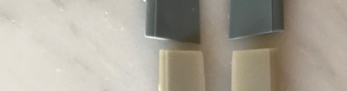 Kit parts (top) compared to resin parts (below).