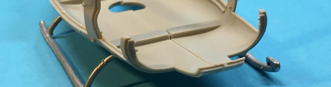 A stand-alone assembly fitted to the upright fuselage parts; note that the steps are mounted on the forward skid tips