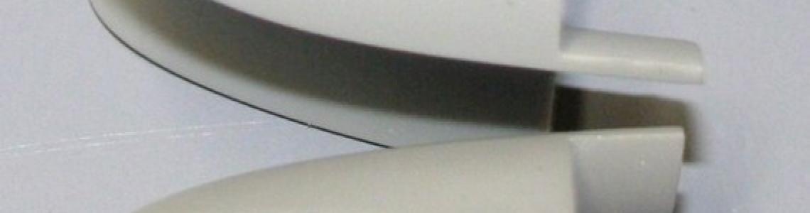 Aires parts held up next to kit items