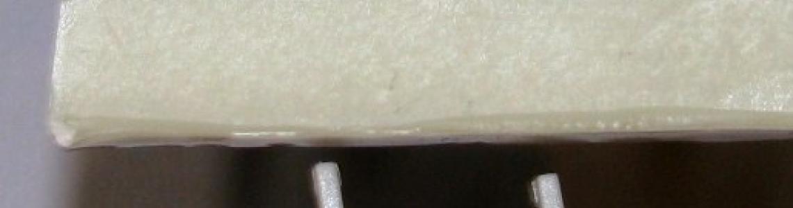 Aires parts held up next to kit items