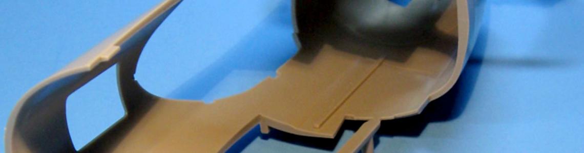 Bottom and back view of the forward section of the fuselage illustrating the 1-piece molding with no seam lines.