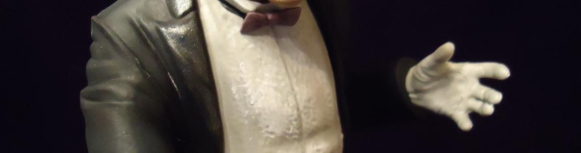 Closeup of the right side of the nefarious Penguin's face, teeth clenching his cigarette holder