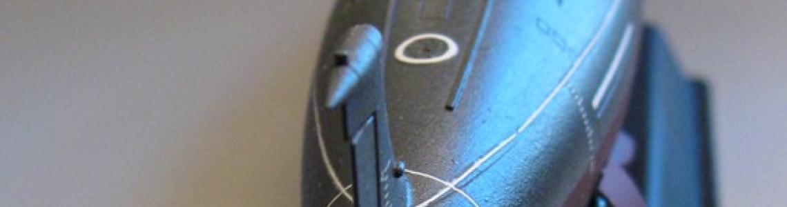 Completed model on display stand stern view showing boat's screw