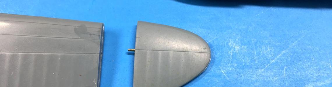 Wing tip brass pin reinforcement