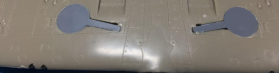 Wheel well plugs and surface engraving detail