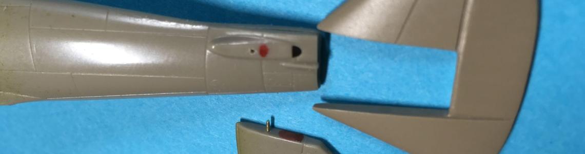 Horizontal tail surface with pins added and vertical tail fin modifications