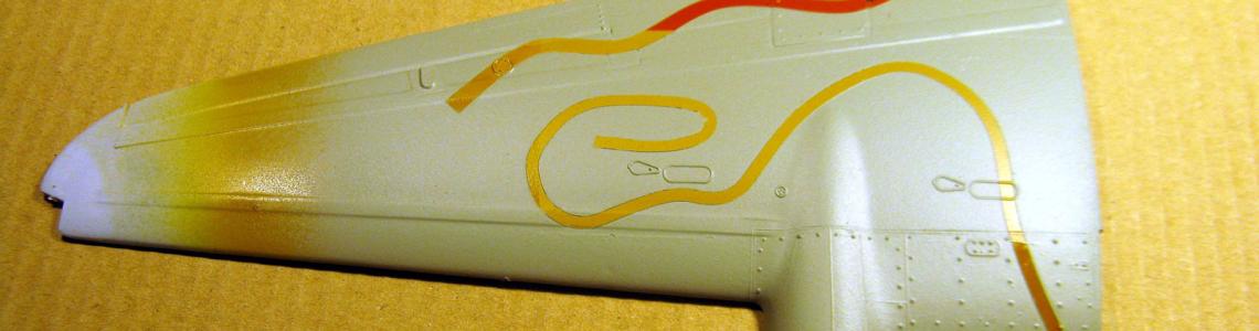The wing after it had been painted in a solid color, the colored areas were masked by the Tamiya tape