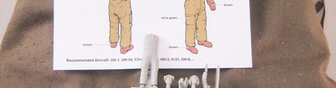 Figure kit contents pictured with authentic flight suit