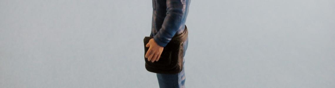 Saluting figure - left side