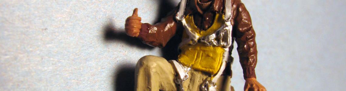 Figure with leather-brimmed hat, front