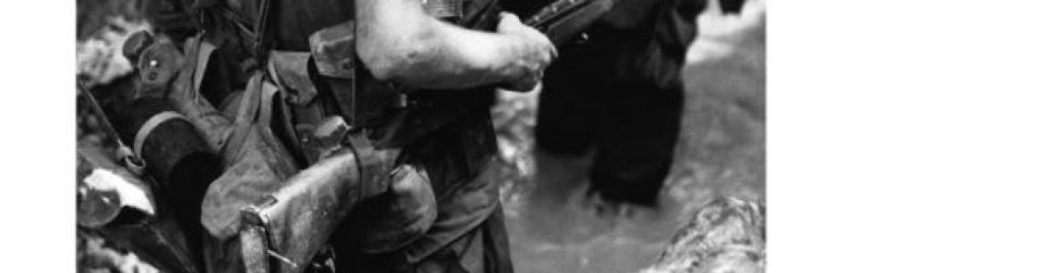 Page 5: Clean, crisp photo of a member of a 3rd Marine Division patrol during Operation "Beacon Hill"