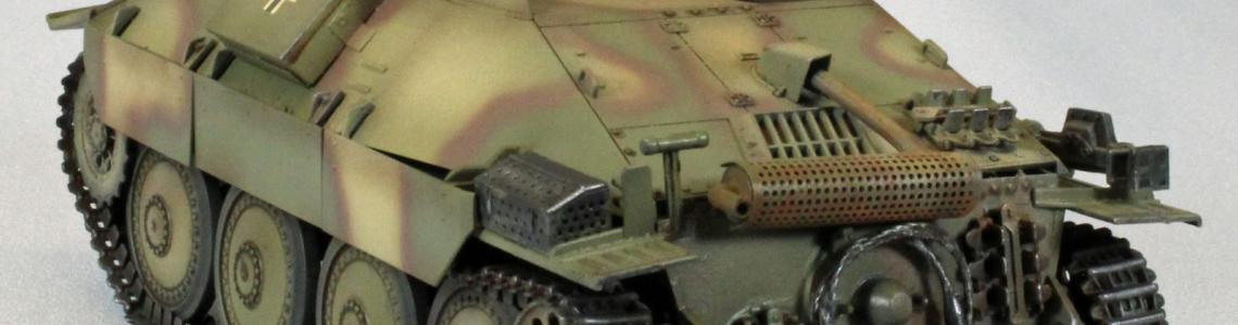 Left-rear quarter view, showing muffler, tow cable, and nice surface detail