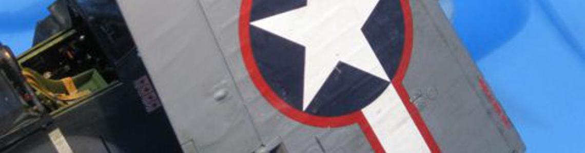 Note how national insignia fits over outboard gas cap and the notch in the decal fits over the middle spent cartridge chute opening.