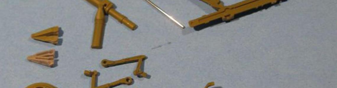 Assembles strut above with component parts shown below.